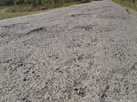Potholes in the road railway station